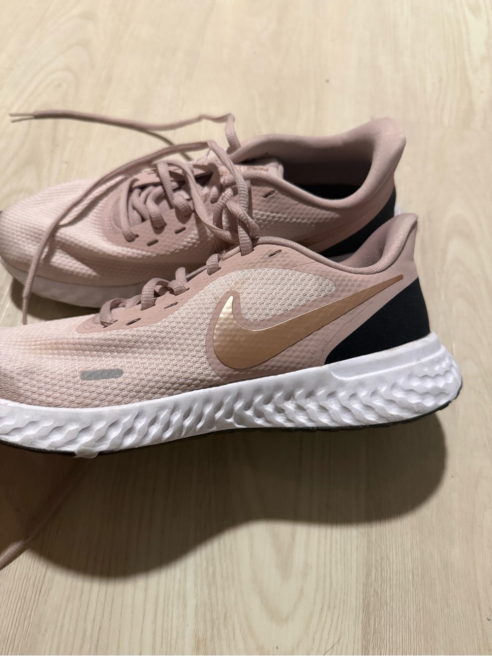 Nike Women’s Blush Pink Running Shoes with Gold Swoosh